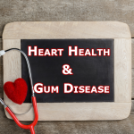 Heart Health and Gum Disease on Chalk Board with stethoscope and heart