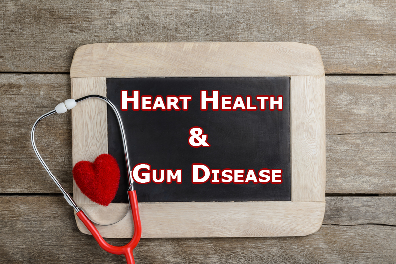 Heart Health and Gum Disease on Chalk Board with stethoscope and heart