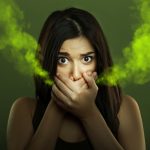 Woman with halitosis